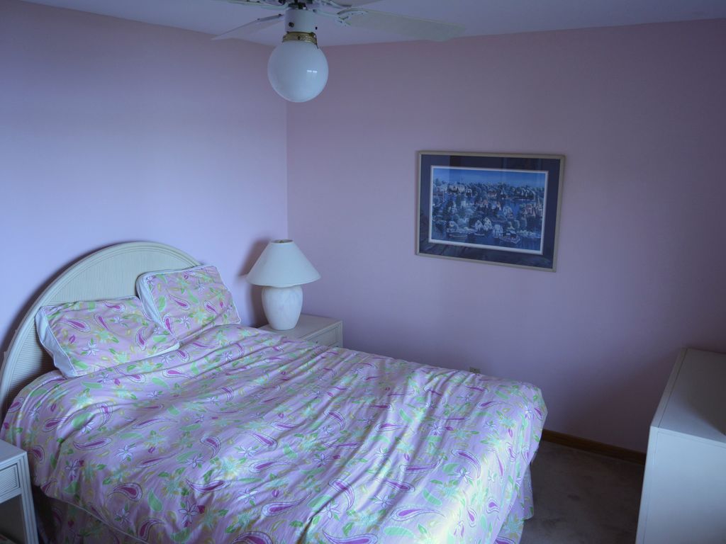 guest bedroom with queen sized bed