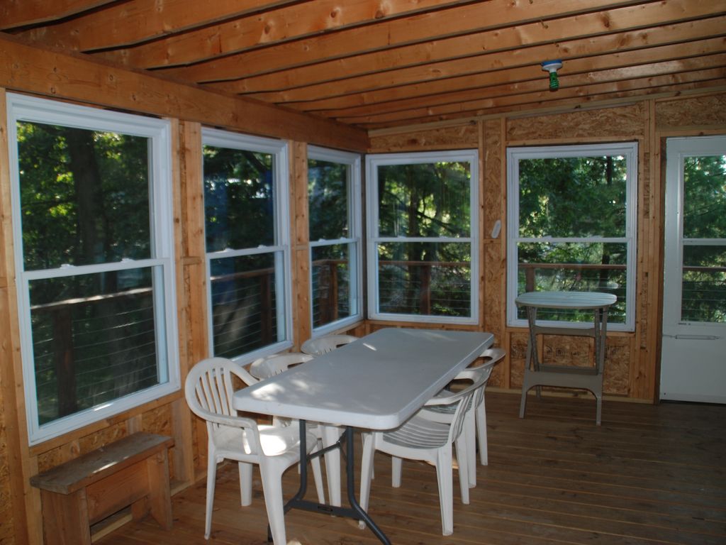 Screened in porch that has view of Island and shipping chann